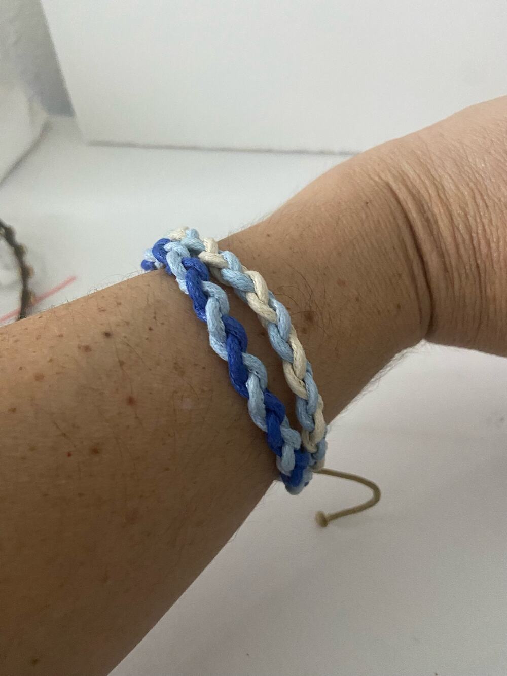 Blue white and beige corded bracelets